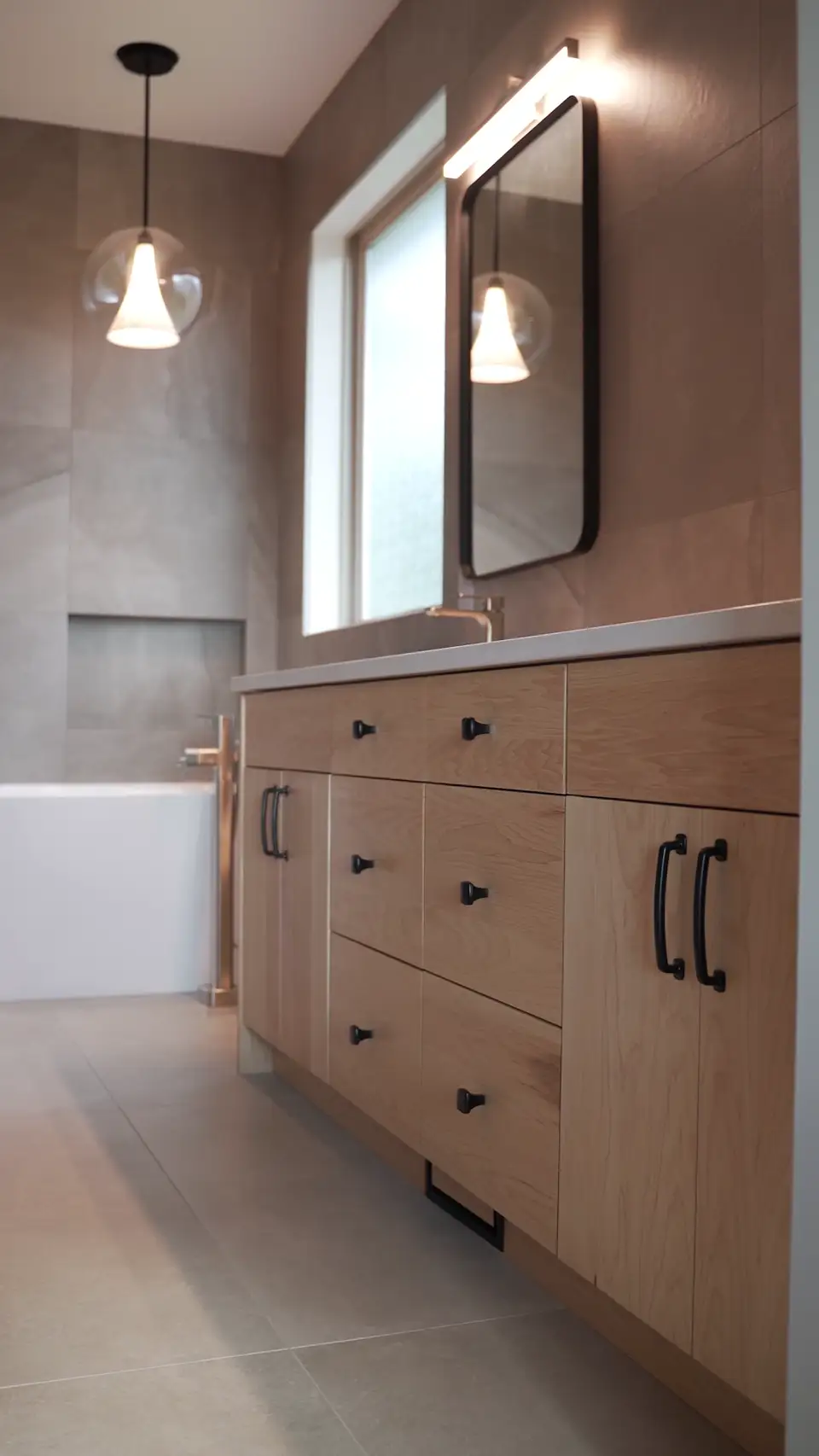 Kelowna bathroom renovation with modern double vanity and elegant finishes
