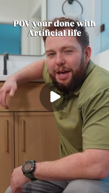 Nailed It team member beside a wood vanity in the white-oak bathroom cabinetry video